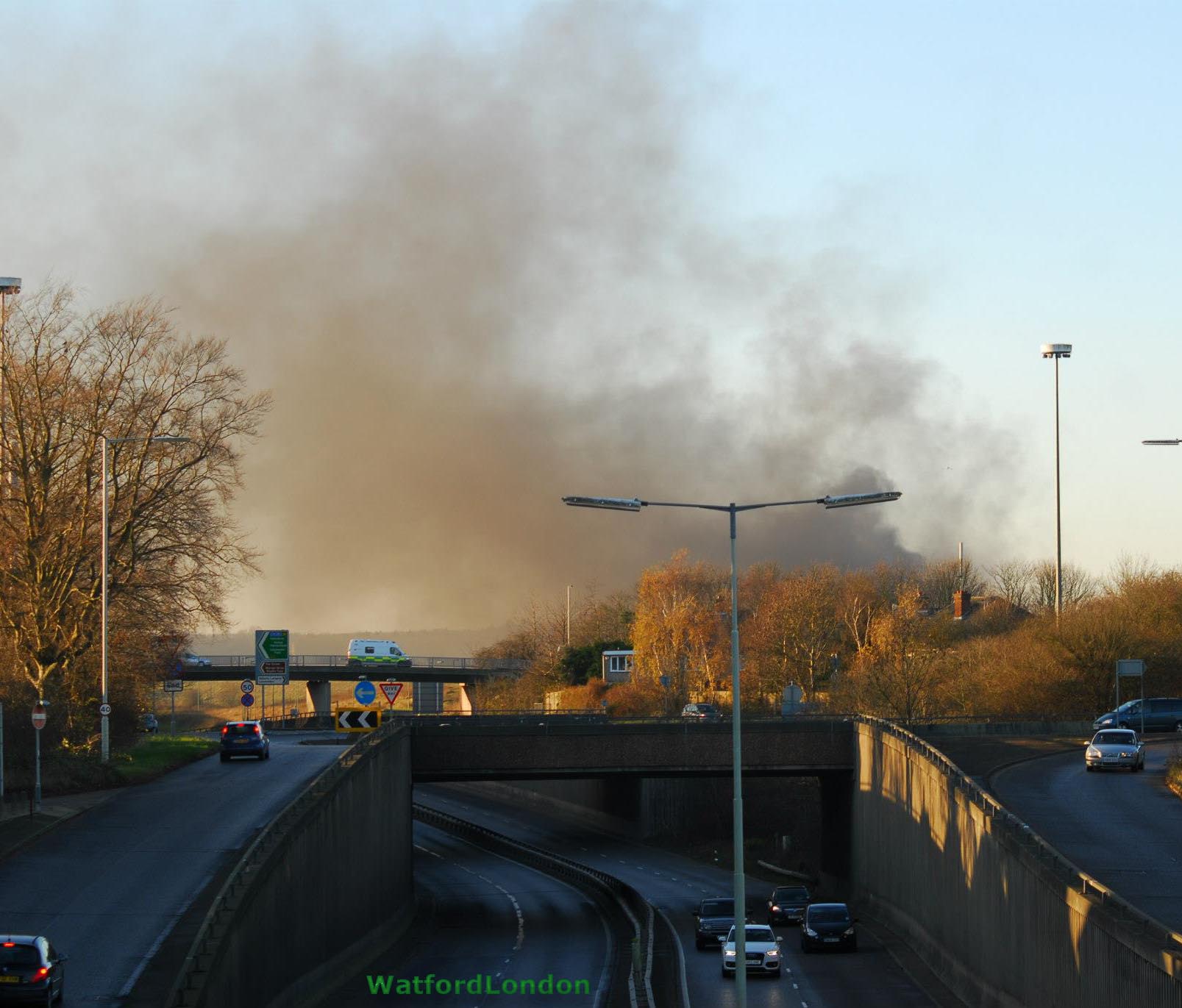 Smoke bellows over A41 Warner Bros Leavesden UK
