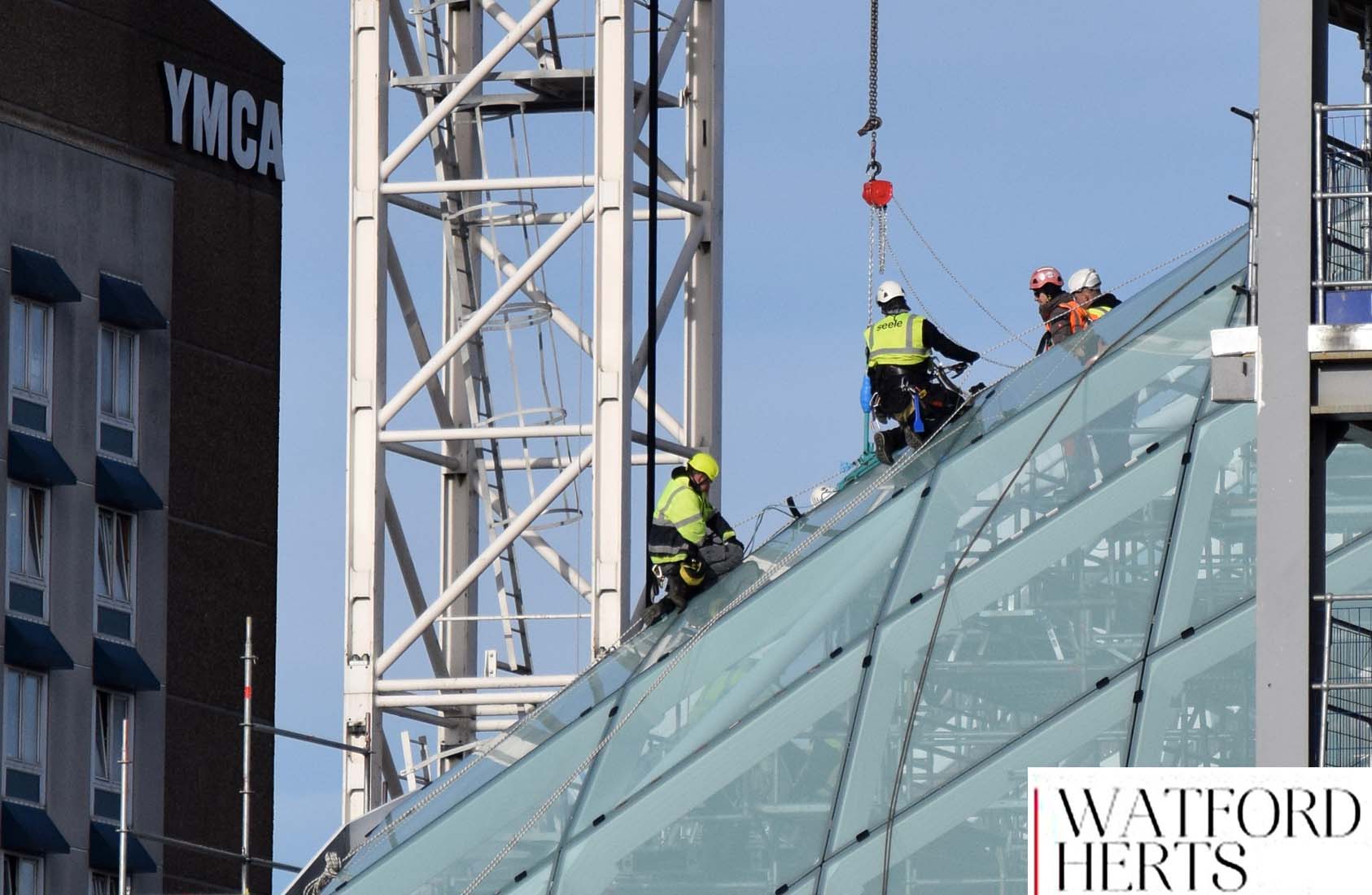 Workmen on top of Glass Roof of Watford Shopping Centre Construction